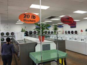 washer and dryers inside of a laundromat